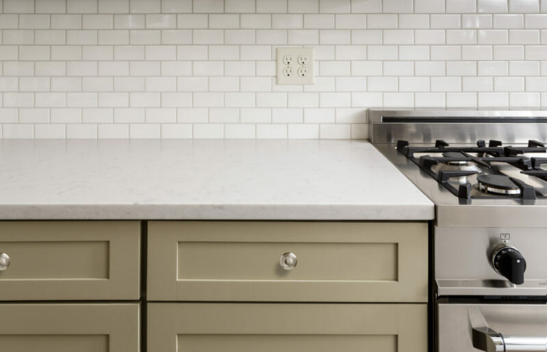 Kitchen Counter with Subway Tile, Stainless Steel oven stove, Shaker Cabinets