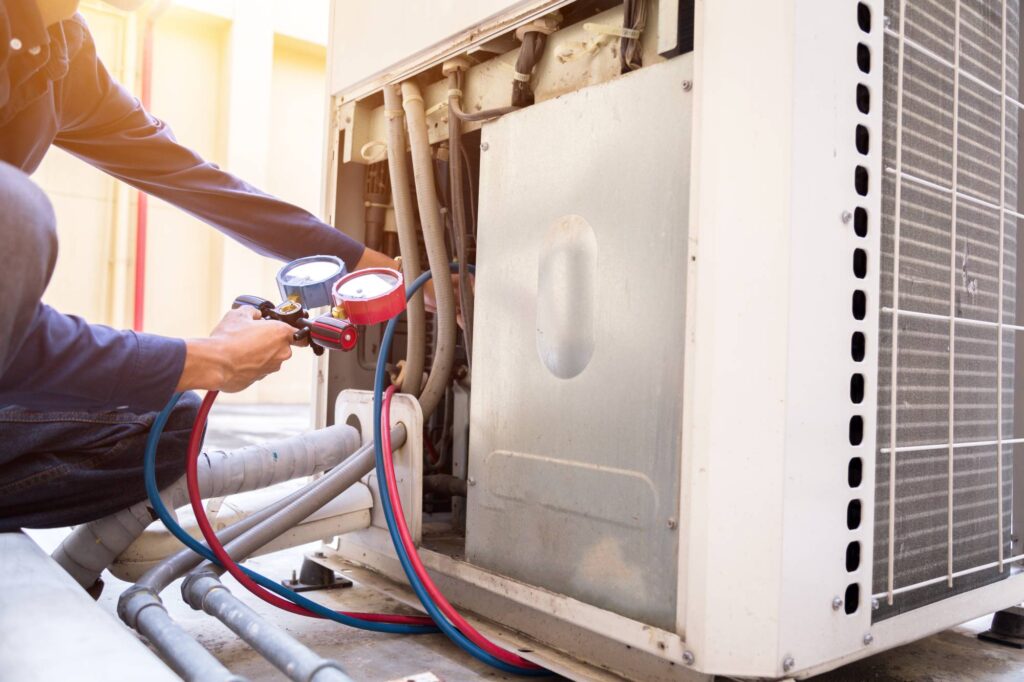 HVAC technician servicing an outdoor unit to improve heating efficiency