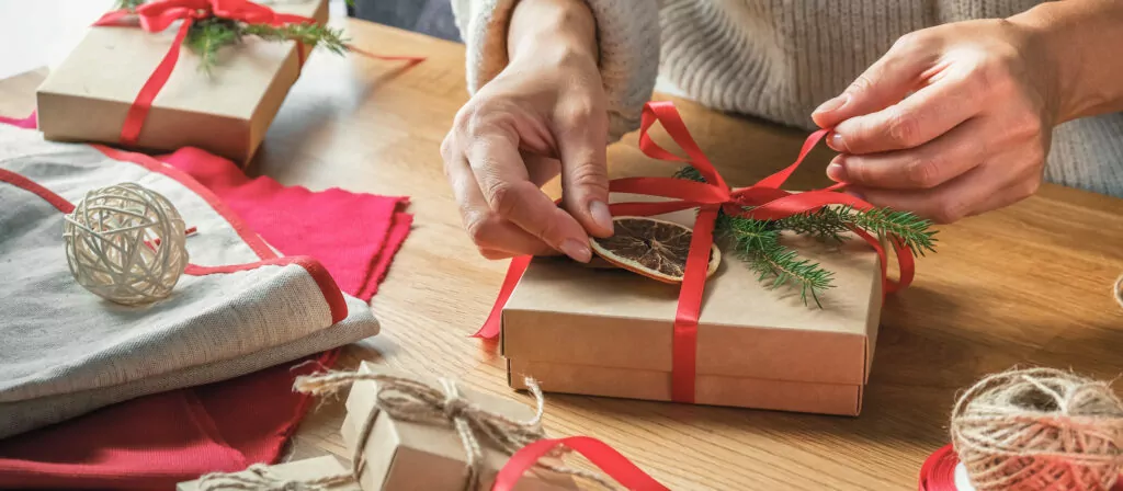 Christmas gift zero waste, eco friendly hand made box packaging gifts in kraft paper wooden table, eco christmas holiday concept, Christmas gift wrapping,eco decor banner