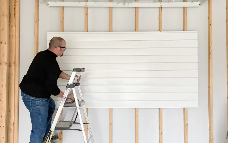 man hanging a tool holder